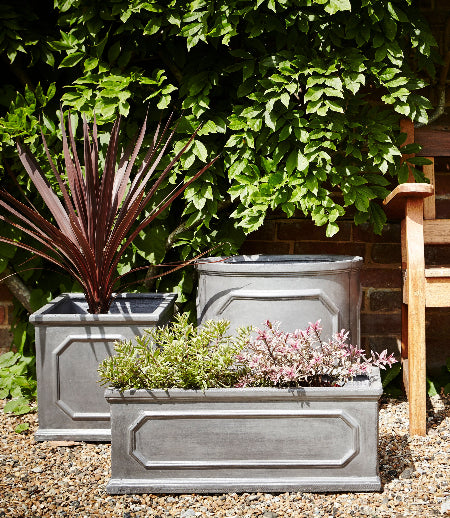 Faux Lead Pots next to park bench