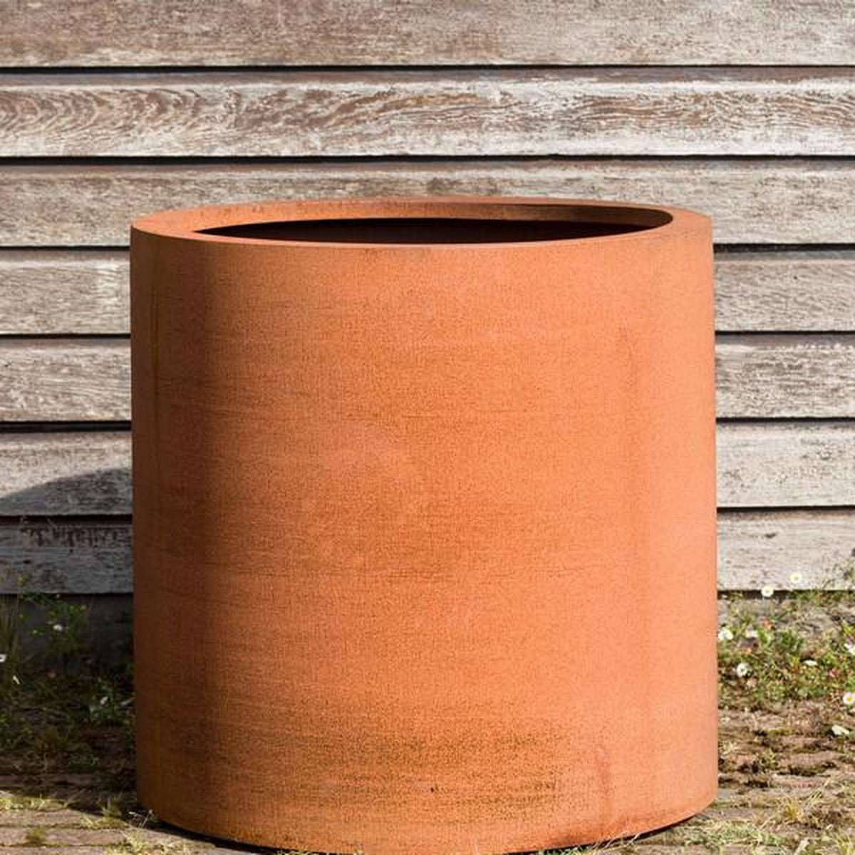 Corten steel cylindrical planter for modern UK gardens and commercial outdoor spaces