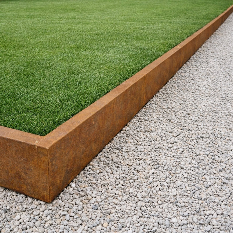 Corten steel garden edging separating lawn and gravel path – premium rusted steel landscape border UK