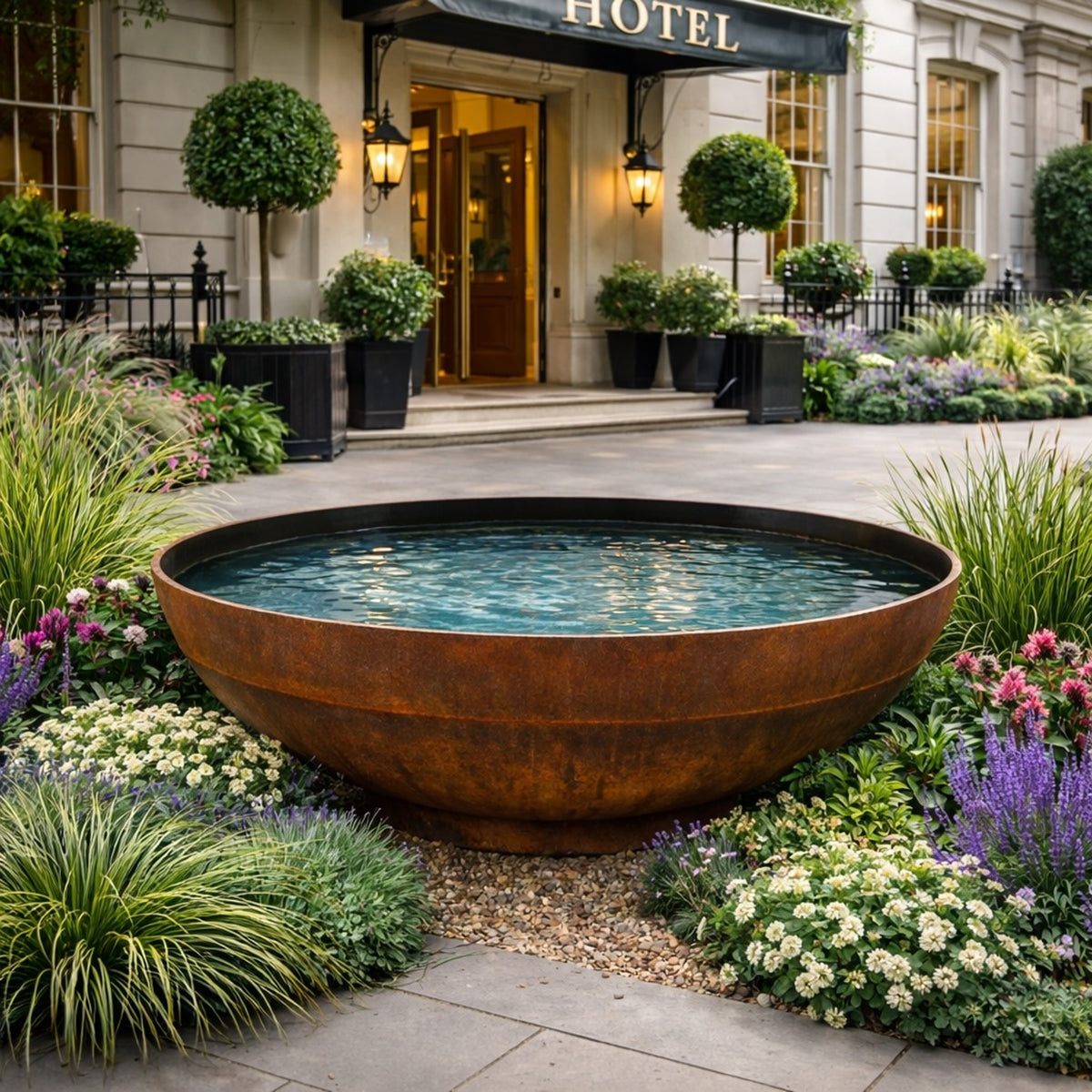 Corten steel water bowl water feature at hotel entrance for commercial landscaping