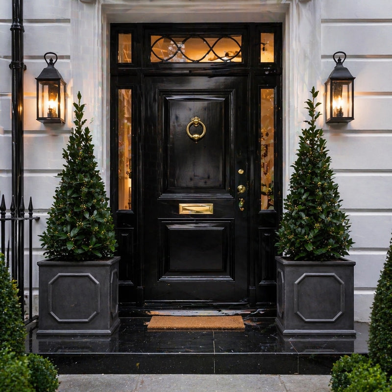 Luxury black front door entrance with faux lead Chelsea cube doorway planters and bay trees UK